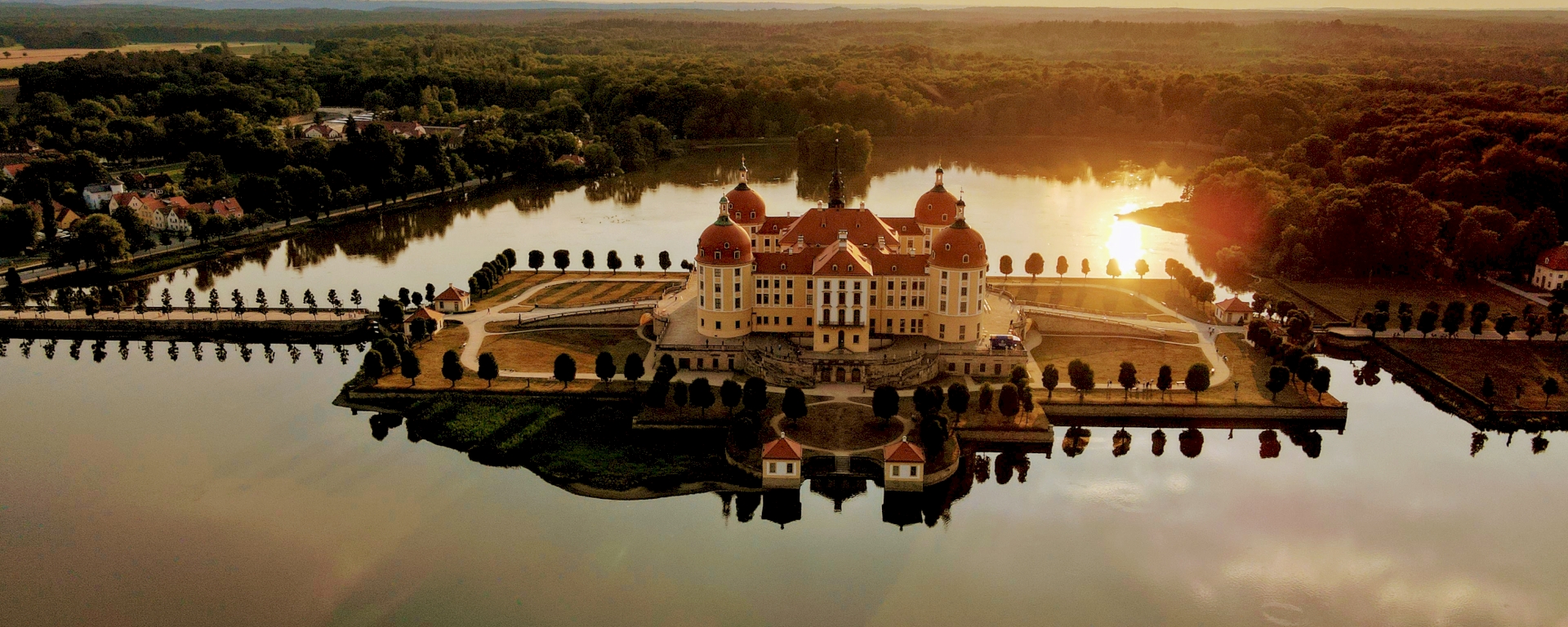 Moritzburg Palace in the sunset surrounded by water