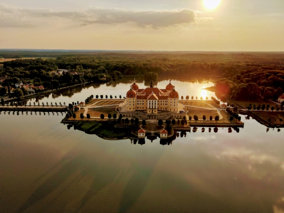 Moritzburg Palace in the sunset surrounded by water