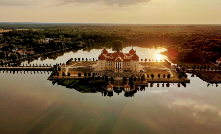 Moritzburg Palace in the sunset surrounded by water