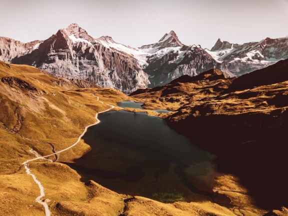 Swiss landscape with snow-capped mountains and beautiful alpine lakes